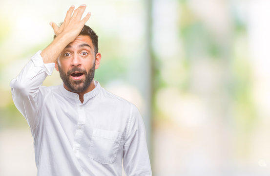 Adult hispanic man over isolated background surprised with hand on head for mistake, remember error. Forgot, bad memory concept.