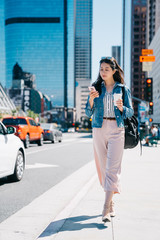 office lady holding coffee and cellphone