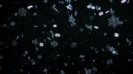 Close up of falling blue snowflake