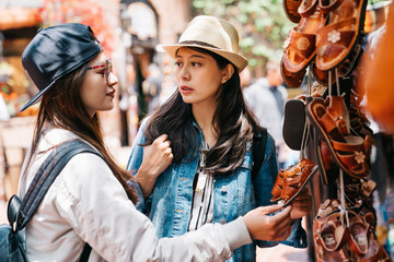 women looking at the cute leather shoes