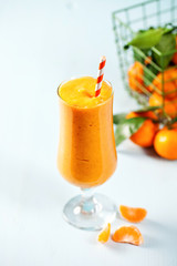 Smoothie from tangerine in a glass