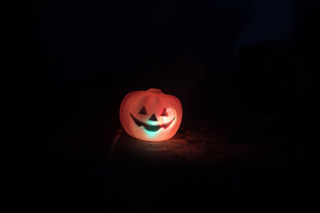 Scary pumpkin in darkroom 