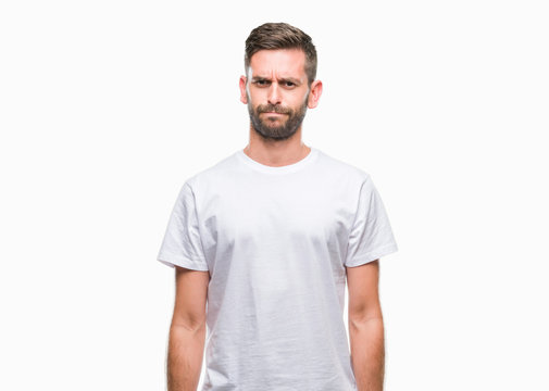 Young handsome man over isolated background skeptic and nervous, frowning upset because of problem. Negative person.