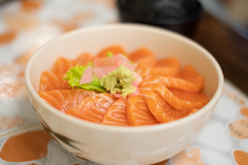 Salmon don - Bowl of steamed rice with salmon sashmi, Japanese traditional food.