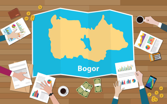 bogor indonesia java city region economy growth with team discuss on fold maps view from top