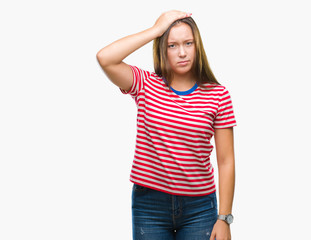 Fototapeta premium Young caucasian beautiful woman over isolated background confuse and wonder about question. Uncertain with doubt, thinking with hand on head. Pensive concept.