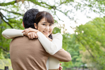 young asian couple in park
