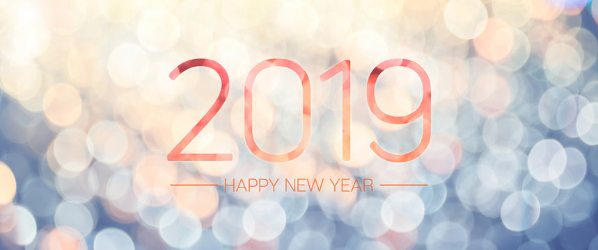 Happy new year 2019 banner with pale yellow and blue bokeh light sparkling background,Holiday greeting card.