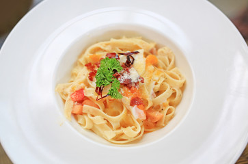 Close-up spaghetti Carbonara on white bowl.