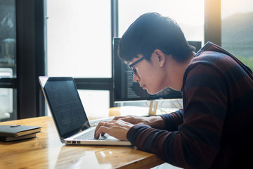 Pensive programmer working on on desktop pc programming code technologies or website design at office Software Development Company