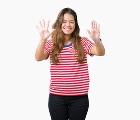 Young beautiful brunette woman wearing stripes t-shirt over isolated background showing and pointing up with fingers number ten while smiling confident and happy.