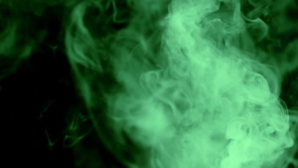 Green gas flow on black background