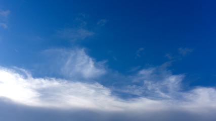 Naklejka na ściany i meble Bright blue sky Gradually cloud on background, with copy space for your text..