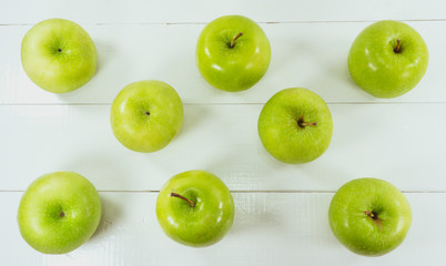 Foods concept apple green on white wood background. top view,Copy space for design. .