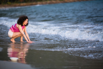 Fototapeta premium Young asian woman on the sea beach.