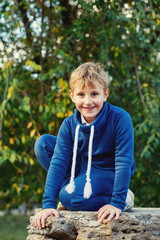 cheerful boy on a walk in the autumn Park