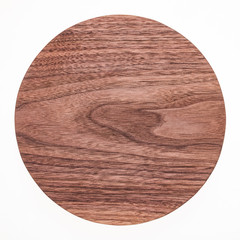 Walnut round pallet, handmade walnut round small chopping board, natural texture element background.
