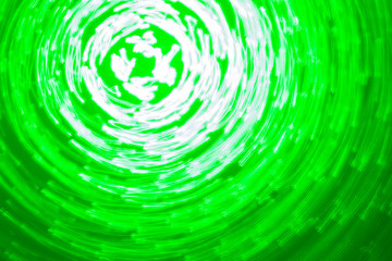 abstract background of green light circles made with lightpainting technique