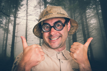 Man with helmet in scary forest in fog