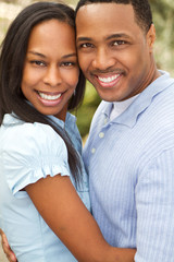 Portrait of a Happy African American couple smiling and hugging.