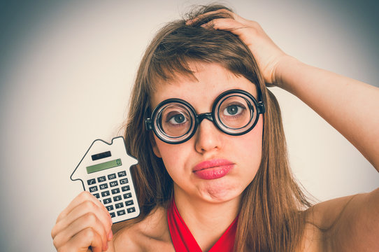 Funny Geek Or Nerd School Woman With Calculator In Her Hand