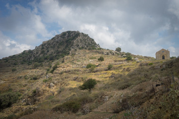 Fototapeta na wymiar Hania, Crete - 09 25 2018: Polirinia. Small mountain village with archaeological remains and small church