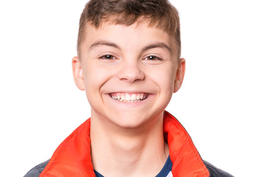 Portrait Of Smiling Teen Boy. Headshot Cute Teenager Looking At Camera. Happy Child Isolated On White Background.