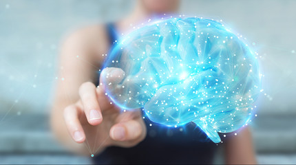 Businesswoman using digital 3D projection of a human brain 3D rendering