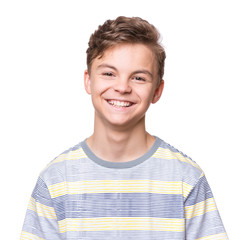 Close up emotional portrait of caucasian teen boy. Head shot of handsome guy. Funny cut teenager, isolated on white background. Child looking at camera.