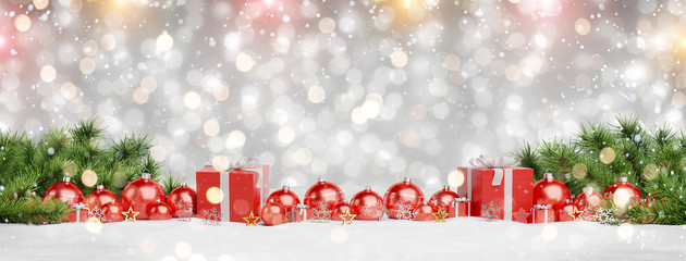 Red christmas baubles and gifts lined up 3D rendering