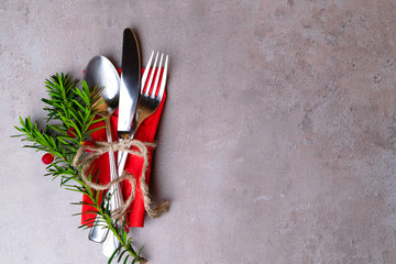 High Angle View of Silver Cutlery Set Wrapped in rope on Stylish grey background with copy space,...
