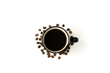 Black coffee in a white ceramic mug and grains on a white background.