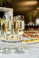 champagne and sparkling wine glasses at banquet night time party new year corporate party concept © irinachevzhik