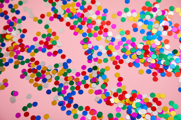 colorful confetti on pinkn background