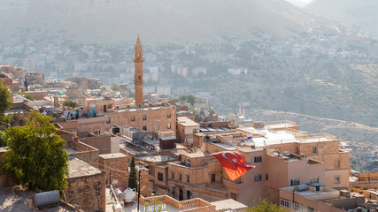 Turkish flag flying in the street of the old city of Mardin