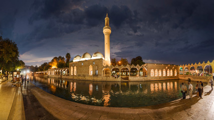 SANLIURFA, TURKEY - SEPTEMBER 14, 2018: people at Balikligol, Halilurrahman Mosque Sanliurfa