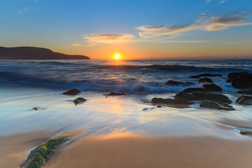Sun, Sand, Sea and Rocky Sunrise