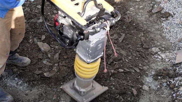 Device for compaction soil /Special device produces soil compaction for construction work.