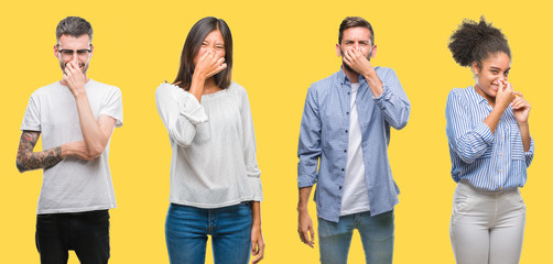 Collage of group people, women and men over colorful yellow isolated background smelling something stinky and disgusting, intolerable smell, holding breath with fingers on nose. Bad smells concept.