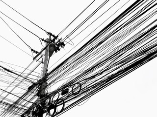 silhouette of busy power cord  and wires,electric line on pole