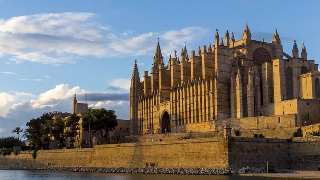 4k Timelapse - Night fall on la Seu, the Cathedral of Palma de Mallorca, and Royal Palace of La Almudaina - Balearic Islands.