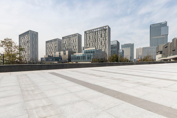 Obraz na płótnie Canvas Panoramic skyline and modern business office buildings with empty road,empty concrete square floor