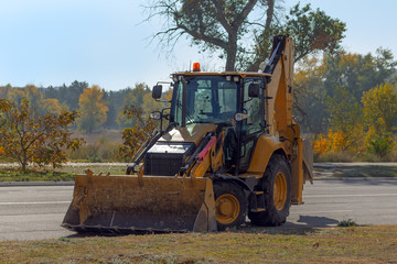road works industrial machinery / staktor standing on the road at lunchtime