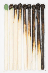 burnt matches white background / gradual burning of matches