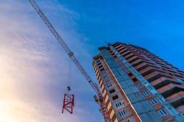 Construction of a residential high house - a house and a crane