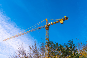 Construction - Crane on a background of blue sky