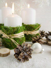 Christmas composition in the Scandinavian style. Candles, natural elements, rustic style.