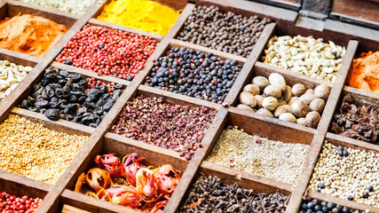 Collection colorful mosaic spices in wooden box. Assortment of condiment cooking ingredient. Seasoning background