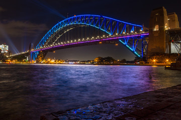 Fototapeta na wymiar Sydney Harbour Bridge lit up in blue colours