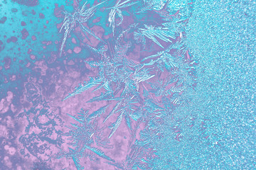 Fototapeta na wymiar Frozen iced background. Ice pattern on the glass. Macro frost